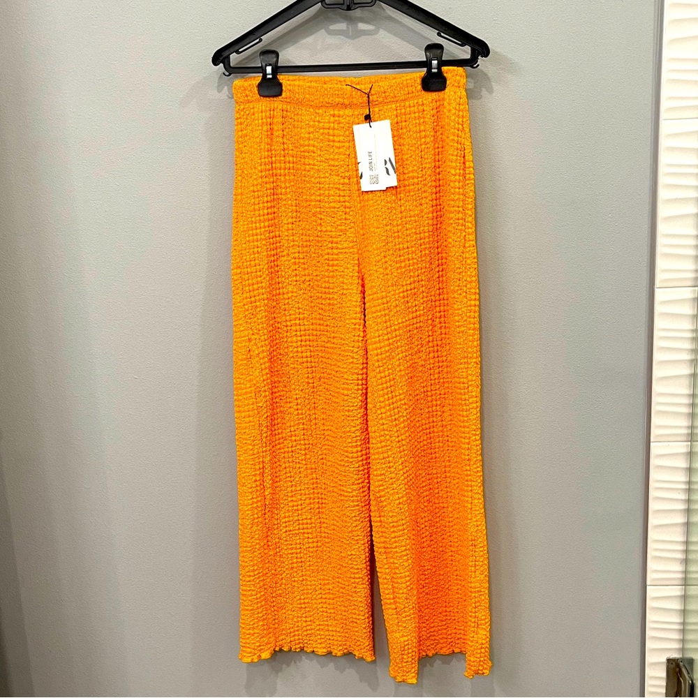 Zara orange girl pants.